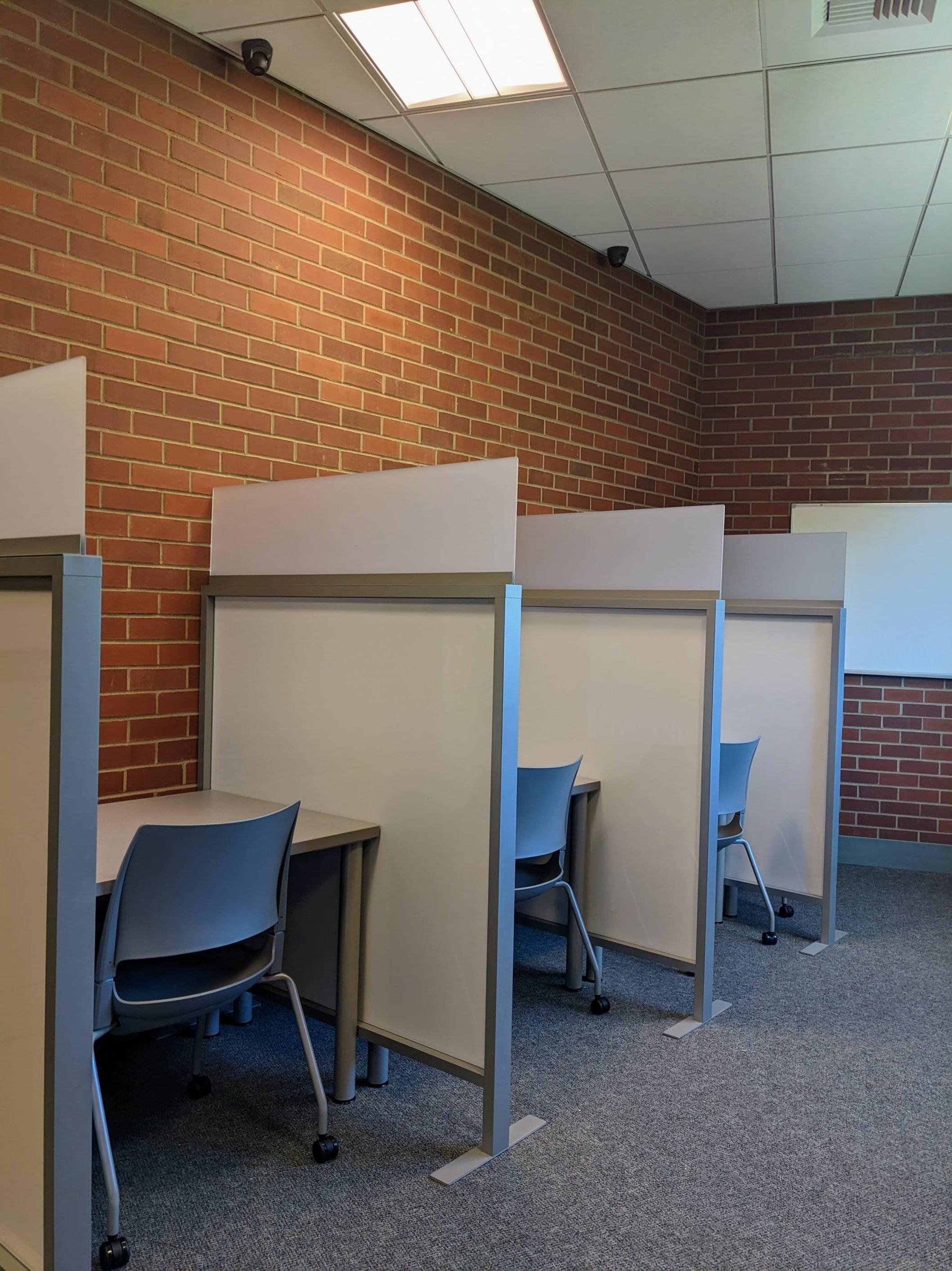 Distraction reduced testing space - 3 cubicles with chairs